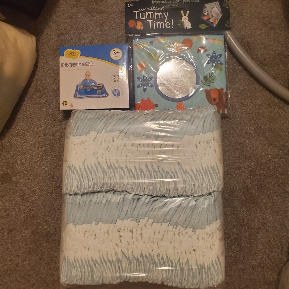 Pampers diapers baby dry size 1, water tummy time mat, and tummy time play book